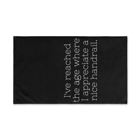 Black towel with white text on a white background
