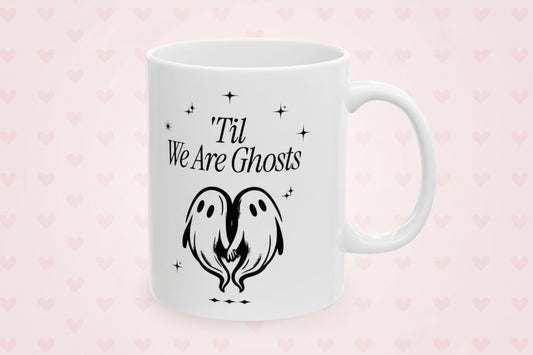 White mug with black text and ghost design on a white background