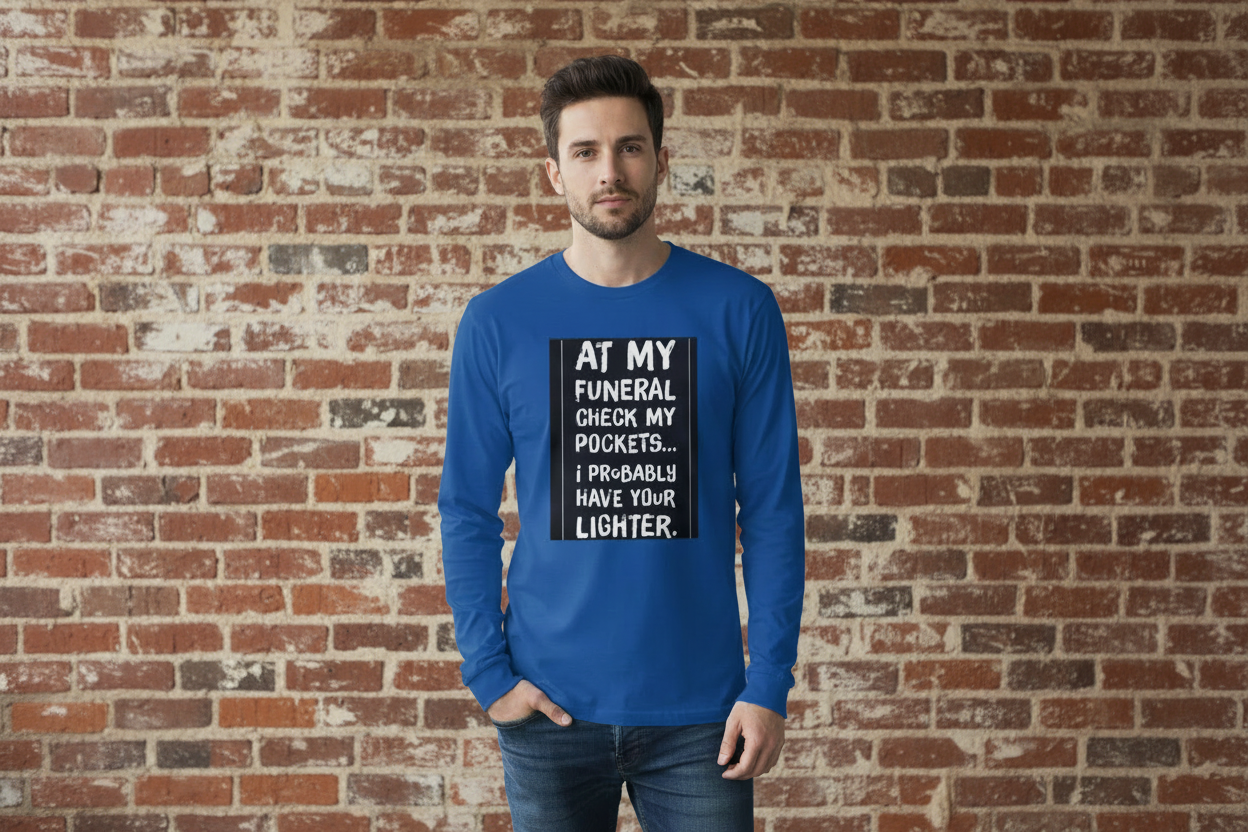 Blue long-sleeve shirt with humorous text design on a dark background