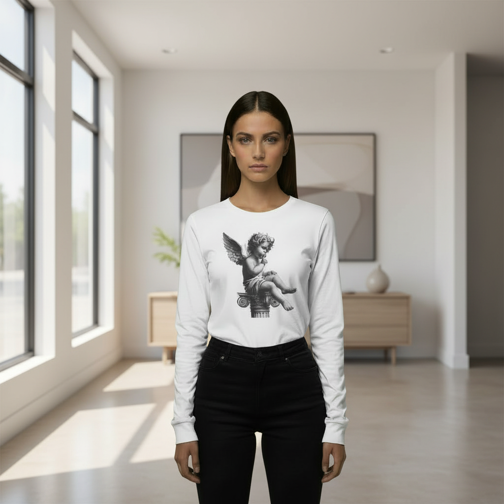 Woman wearing a white long-sleeve shirt with a graphic design in a bright room.
