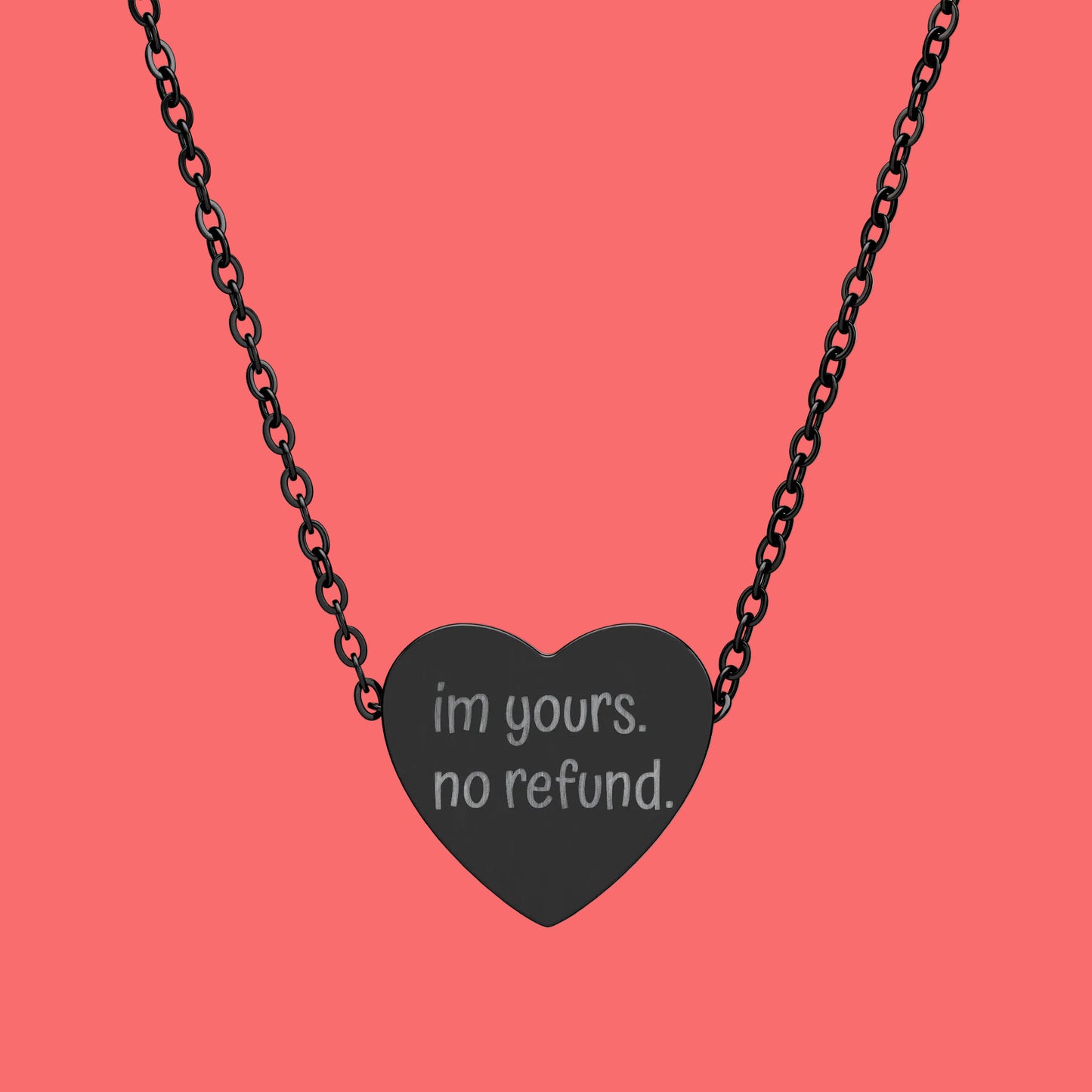 Heart-shaped necklace with 'im yours. no refund.' text on a white background