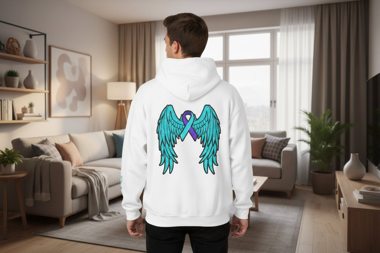 White hoodie with teal wings and purple ribbon design on a purple background