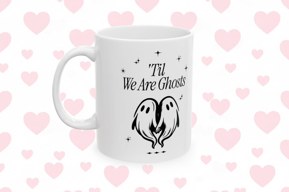 White mug with black text and ghost design on a white background