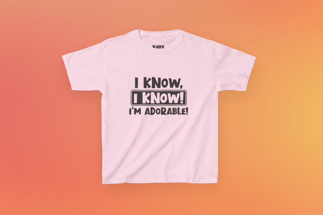 Pink t-shirt with black text on a white background